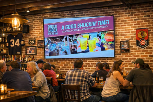 DDM indoor digital billboard screen inside a local restaurant with customers dining