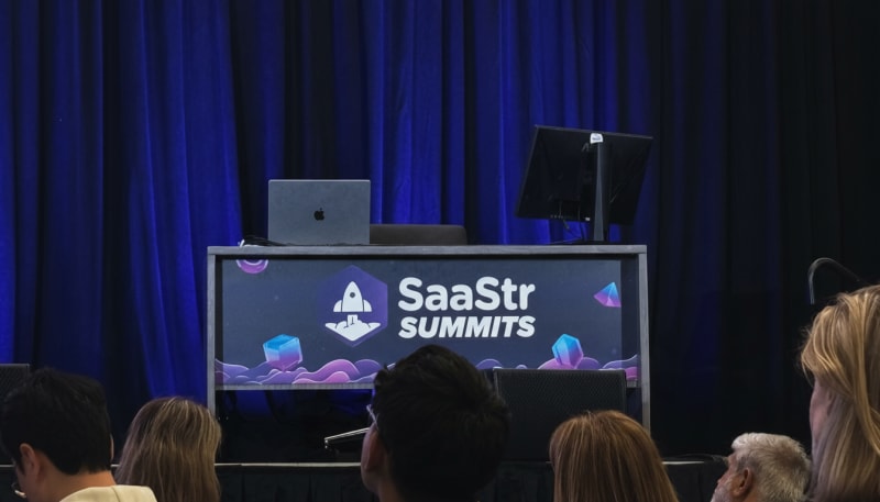 SaaStr Annual conference main stage with large LED display and audience seating