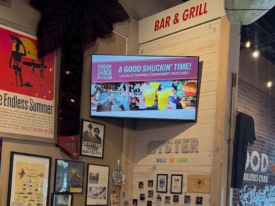 Approved DDM advertiser creative displayed in a venue