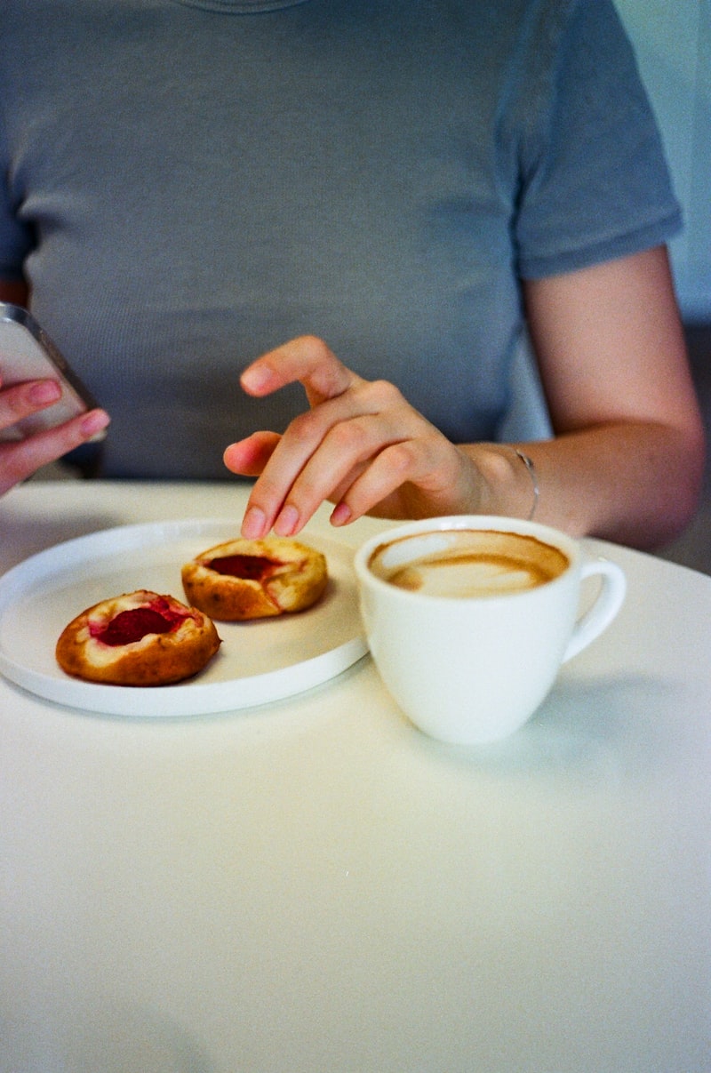 Coffee and pastries on a café table