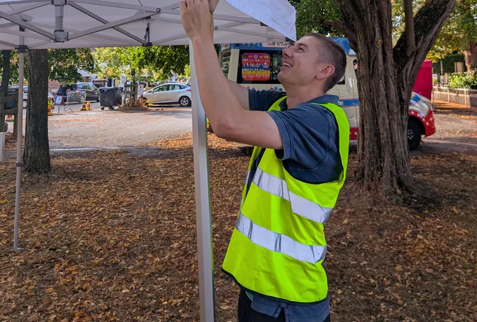 Moments Covered team member preparing a marquee setup