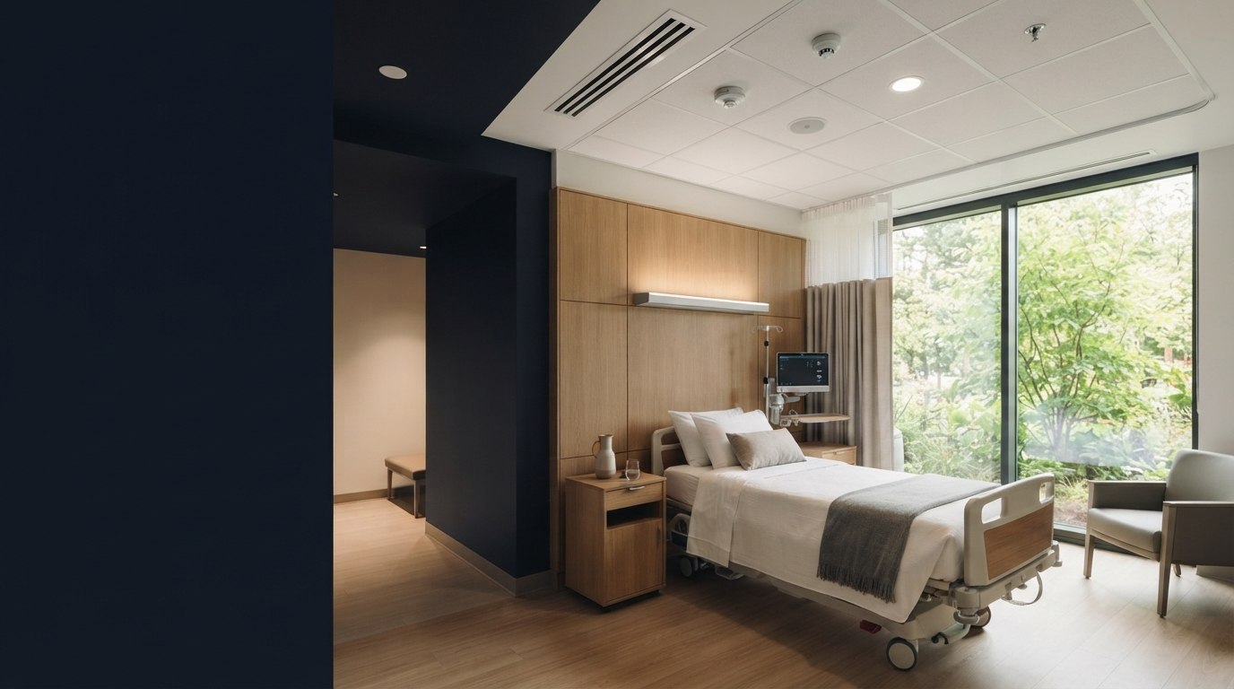 Healthcare patient room with daylight, greenery, and visible air ventilation detail
