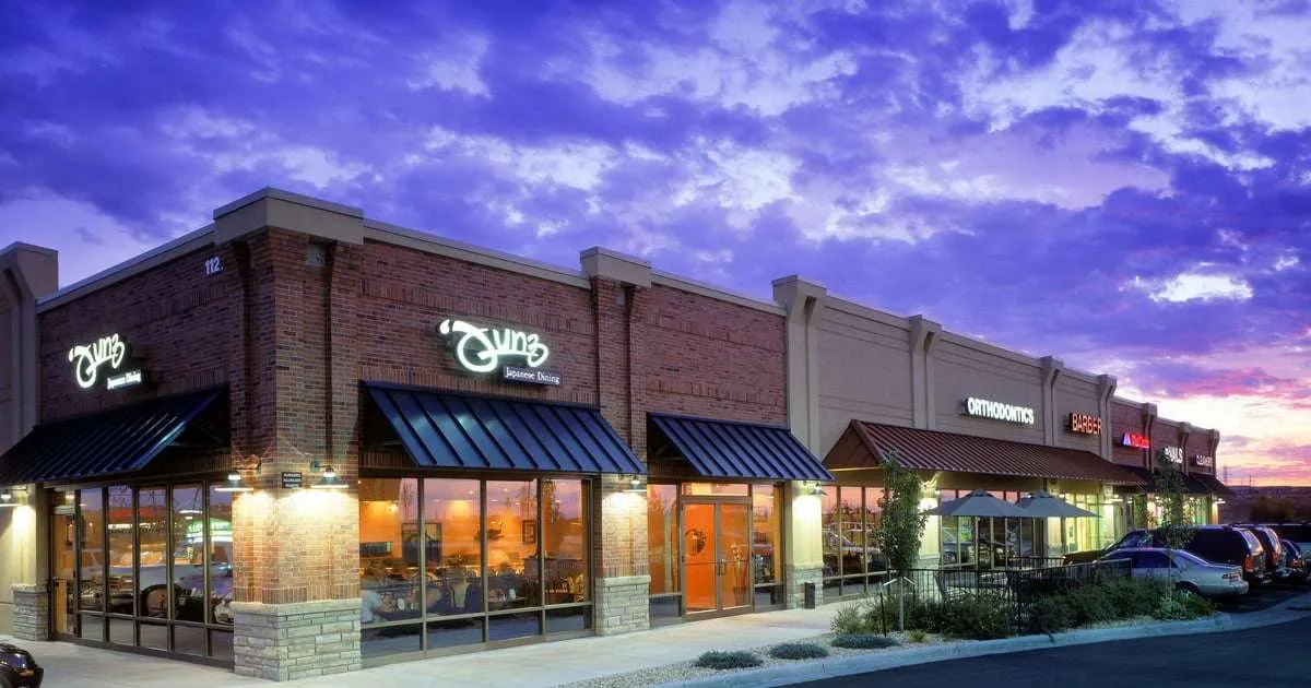 Junz Sushi storefront in a Parker, Colorado shopping center at dusk