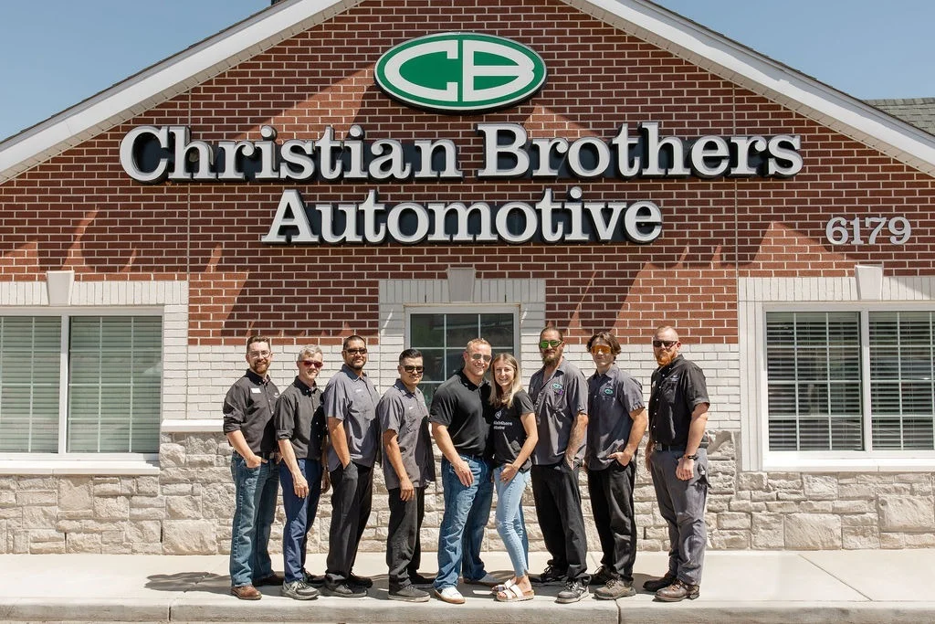 Christian Brothers Automotive Firestone team standing in front of the shop